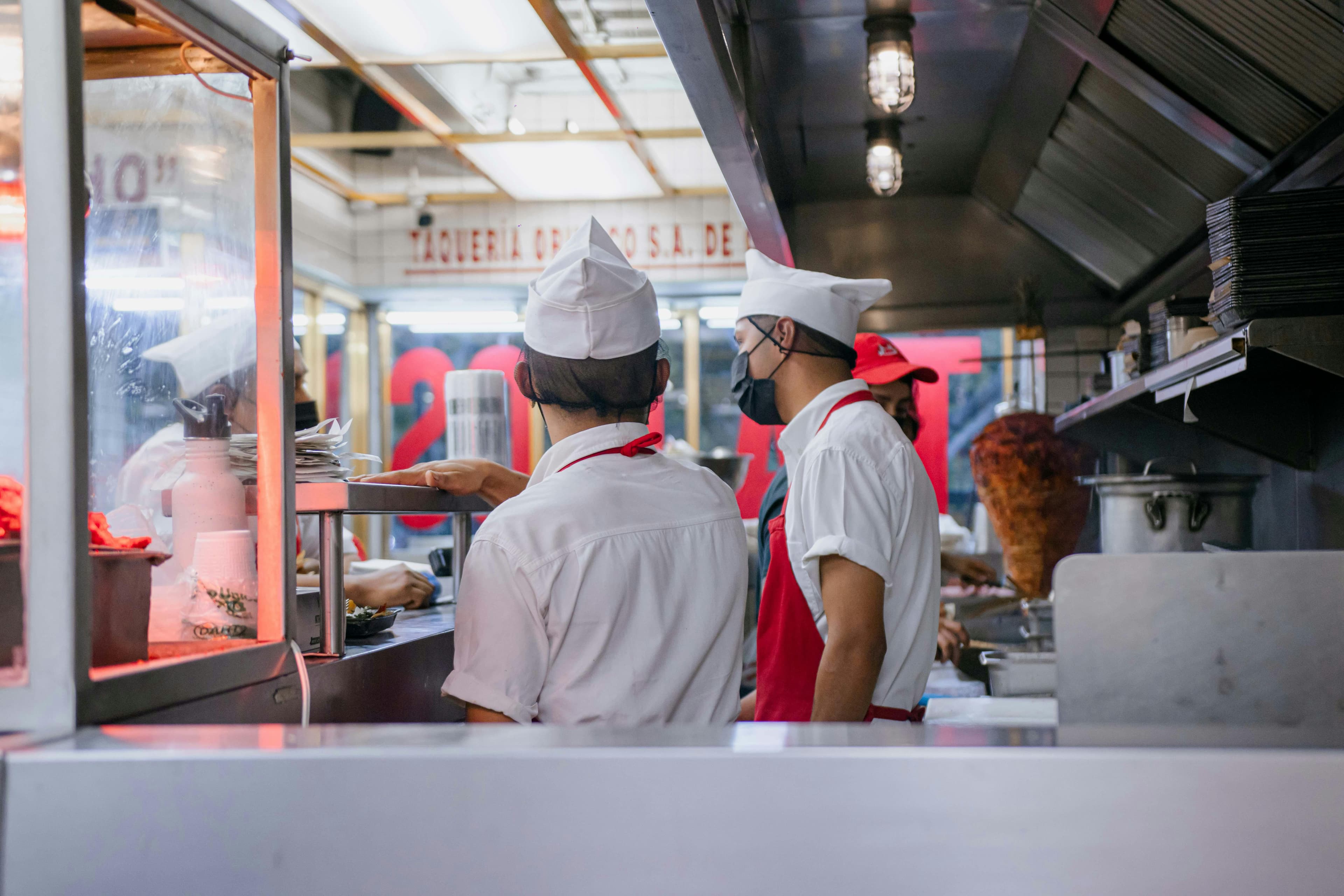 Restaurant staff working in a commercial kitchen